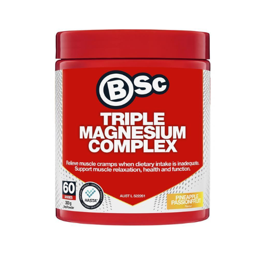A red plastic tub of BSc Triple Magnesium Complex supplement with a white and red label, featuring the BSc logo and 'Pineapple Passionfruit' flavor badge, on a white background.