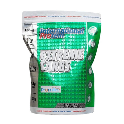 A sealed pouch of Promilin Extreme Carbs carbohydrate supplement with the label showing '117g' and 'natural'. The packaging is primarily green and white with additional colors and text indicating the product's benefits and weight.