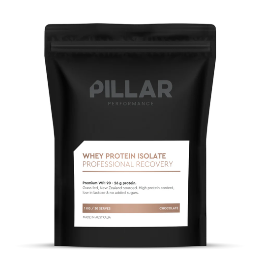 A black stand-up pouch of PILLAR Performance Whey Protein Isolate in Chocolate flavor, shown on a clean white background.